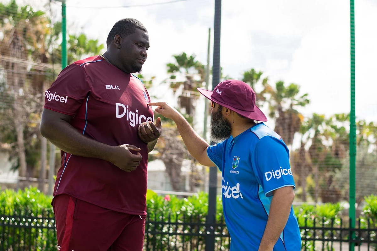 West Indies’ Rahkeem Cornwall with former Pakistan cricketer Mushtaq Ahmed