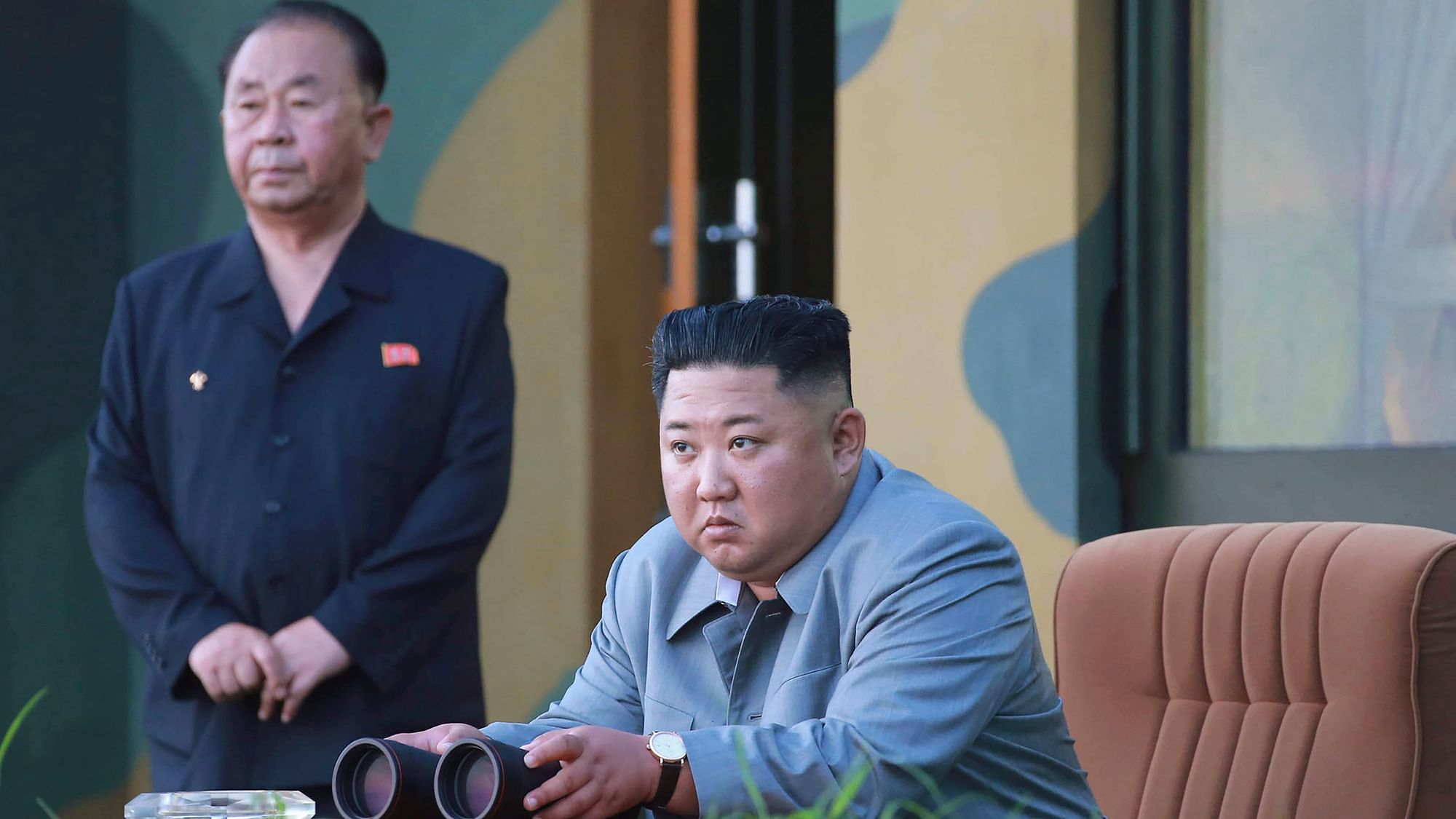 North Korean leader Kim Jong Un watches a missile test.