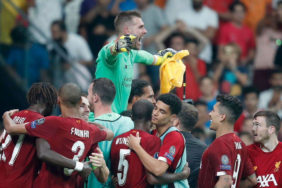 Backup goalkeeper Adrian saved the final kick of the shootout as Liverpool beat Chelsea to win the Super Cup.