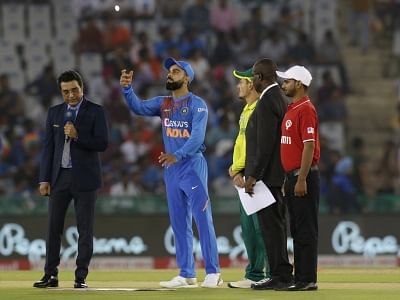 Mohali: Indian skipper Virat Kohli and South African skipper Quinton de Kock during the toss ahead of the 2nd T20I match between India and South Africa at Punjab Cricket Association IS Bindra Stadium in Mohali on Sep 18, 2019. (Photo: Surjeet Yadav/IANS)