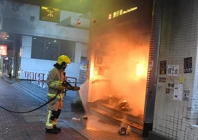 HONG KONG, Sept. 15, 2019 (Xinhua) -- A firefighter tries to put out a fire at the mass transit railway (MTR) Wan Chai station in Hong Kong, south China, Sept. 15, 2019. Rioters set fires in Central and Admiralty areas, threw petrol bombs at the Hong Kong Special Administrative Region (HKSAR) government offices and vandalized mass transit railway (MTR) stations Sunday. (Xinhua/IANS)