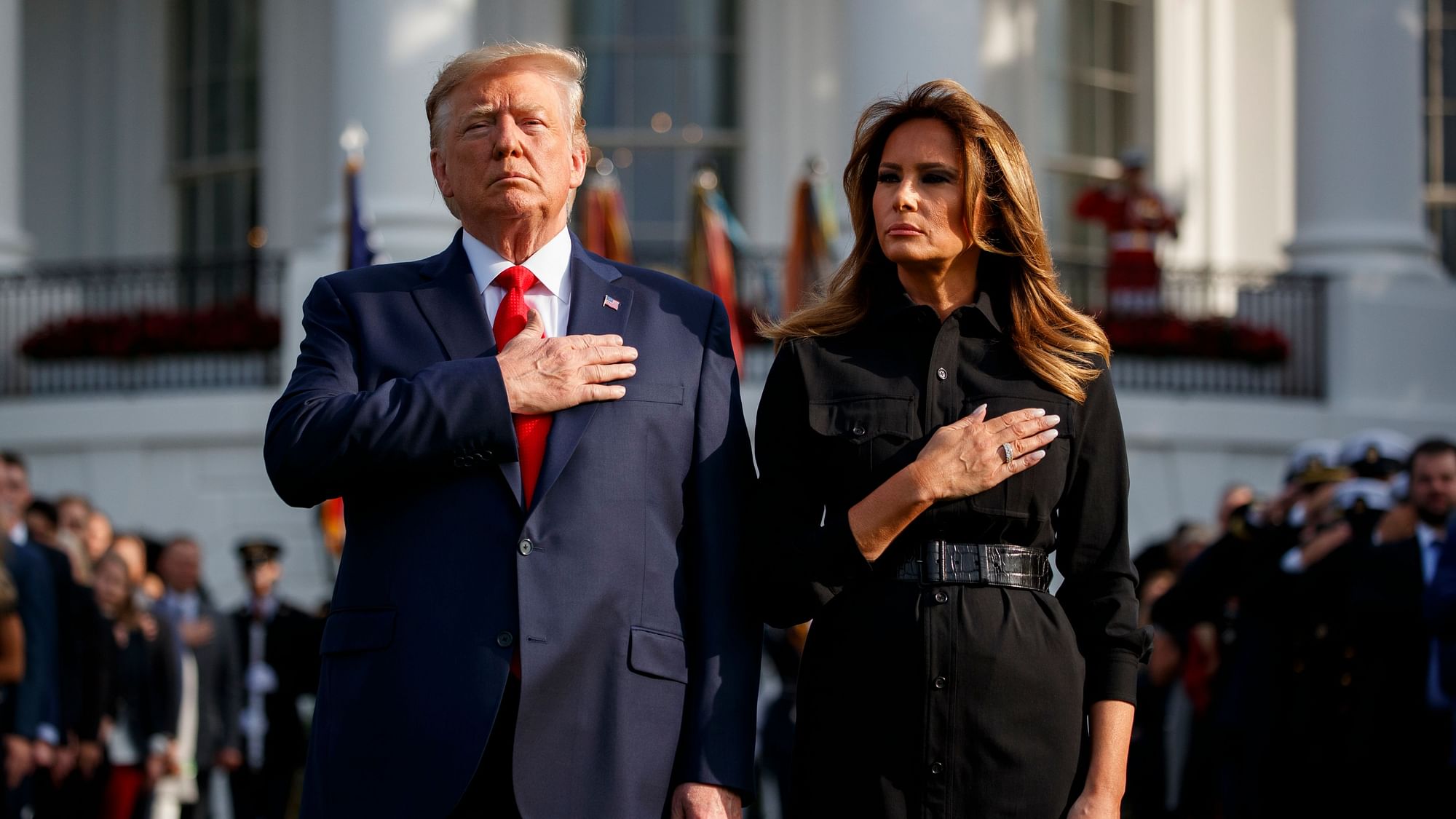 President Donald Trump and first lady Melania Trump participate in a moment of silence honoring the victims of the 11 September terrorist attacks.