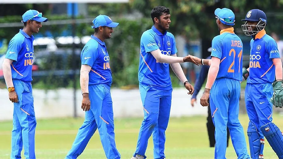 Atharva Ankolekar (centre) finished with figures of 5 for 28 from 8 overs.
