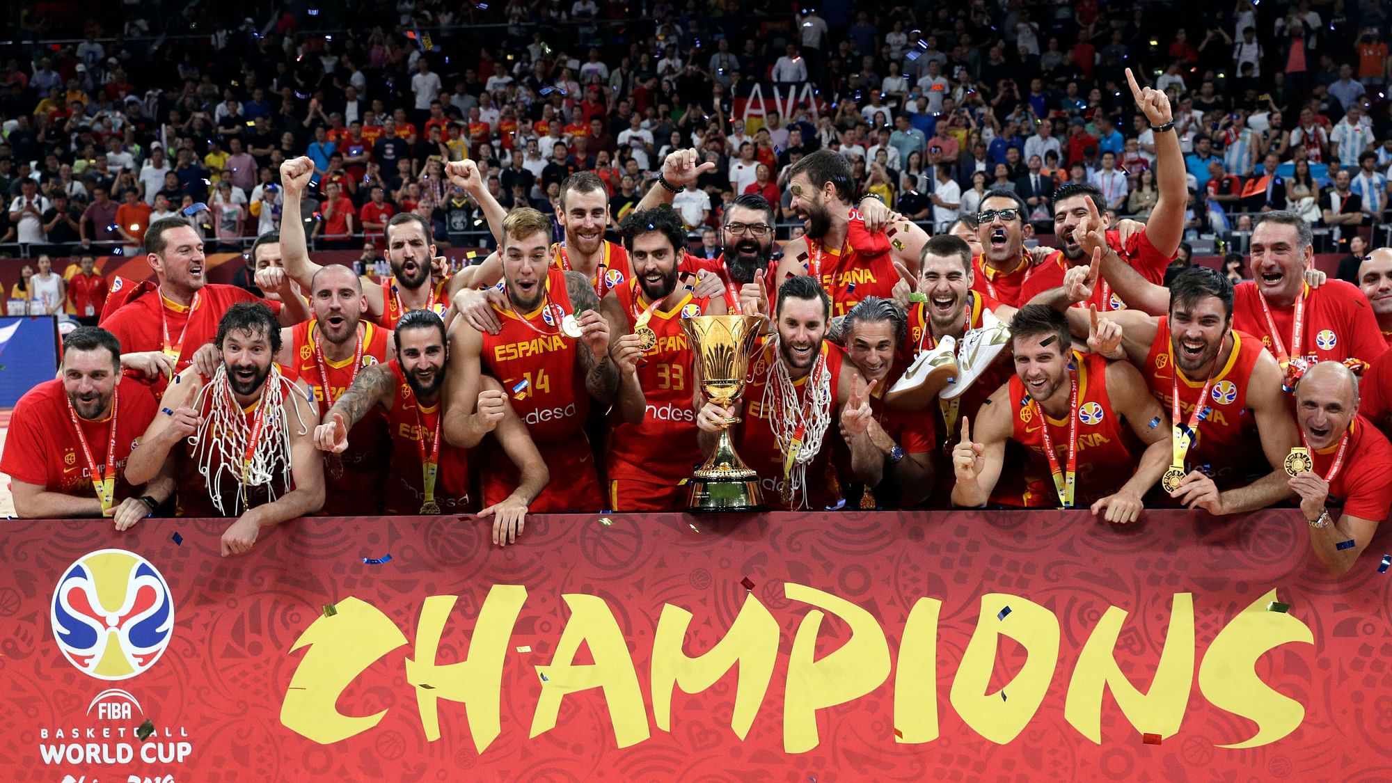 Members of Spain’s team celebrate with the Naismith Trophy after they beat Argentina in their first-place match in the FIBA Basketball World Cup at the Cadillac Arena in Beijing, Sunday, Sept. 15, 2019.