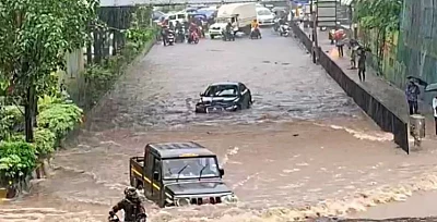 Amid heavy rain that has disrupted normal life here, with people posting pictures and videos on the citys flooded roads, a video has gone viral showing a Jaguar is stranded in a flooded underpass at Airoli in Navi Mumbai, but an Indian-made SUV Bolero zips past despite the flooding and gets to the other side of the road without any incident.