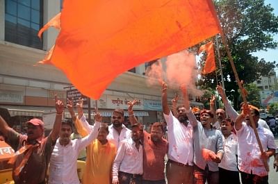 Mumbai: Workers of Shiv Sena (an ally of the BJP led NDA) celebrate after the BJP led by Prime Minister Narendra Modi was set to retain power for another five years after making a sweep of the Lok Sabha battle and mauling the opposition; in Mumbai on May 23, 2019. (Photo: IANS)
