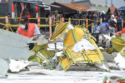 JAKARTA, Nov. 4, 2018 (Xinhua) -- Investigators check debris of Lion Air JT 610 at Tanjung Priok Port in Jakarta, Indonesia, Nov. 4, 2018. (Xinhua/Veri Sanovri/IANS)