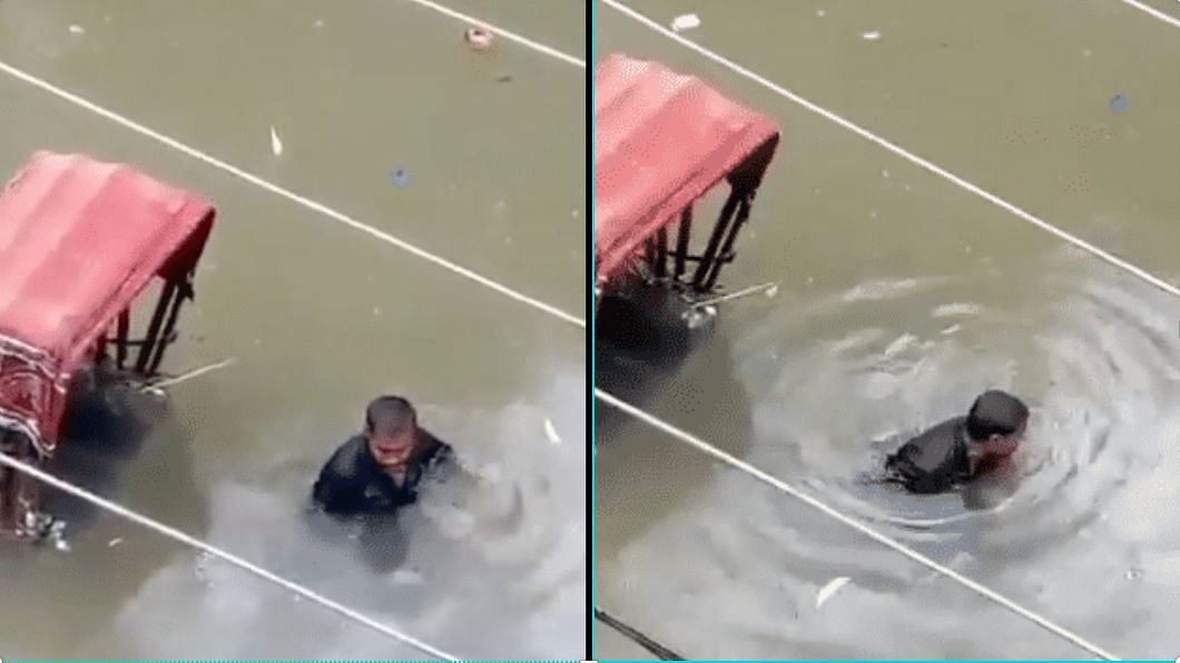 The heartbreaking video shows a man, stuck in a flooded street, crying profusely to let go of his source of income.