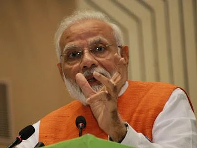 New Delhi: Prime Minister Narendra Modi addresses during a programme where he presented Yoga Awards, released 12 commemorative postal stamps and launched 10 AYUSH Health and Wellness Centres in Haryana; in New Delhi on Aug 30, 2019. (Photo: Amlan Paliwal/IANS)