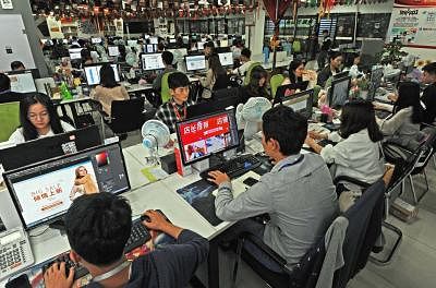 BEIJING, May 7, 2019 (Xinhua) -- Staff members work at an e-commerce service company in Yiwu, east China