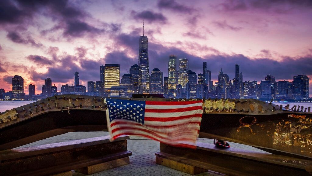 A US flag hanging from a steel girder, damaged in the 11 September 2001 attacks on the World Trade Center, blows in the breeze at a memorial in Jersey City, on 11 September 2019 in New York City on the 18th anniversary of the attacks.&nbsp;