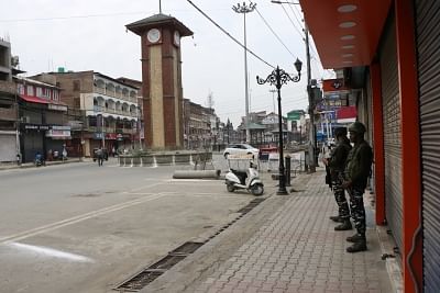 Srinagar: Security beefed up as authorities imposed restrictions in parts of Srinagar city to prevent separatist called protests in connection with the Martyrs Day, on July 13, 2019. July 13 is observed as Martyrs Day in Jammu and Kashmir to remember those killed in the firing outside the Srinagar Central Jail by forces of the Dogra Maharaja in 1931. Shops, public transport and other businesses remained closed in Srinagar and many other towns in the Kashmir Valley. (Photo: IANS)