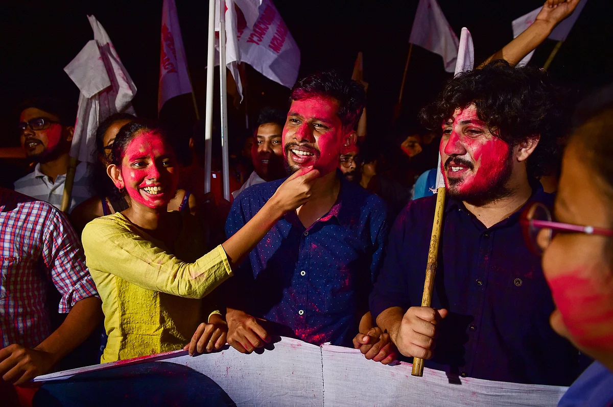 Newly-elected JNUSU President Aishe Ghosh (L), Vice-President Saket Moon (C) and others celebrate after Delhi High Court declared results of Jawaharlal Nehru University Students Union (JNUSU) polls, at JNU Campus in New Delhi. 
