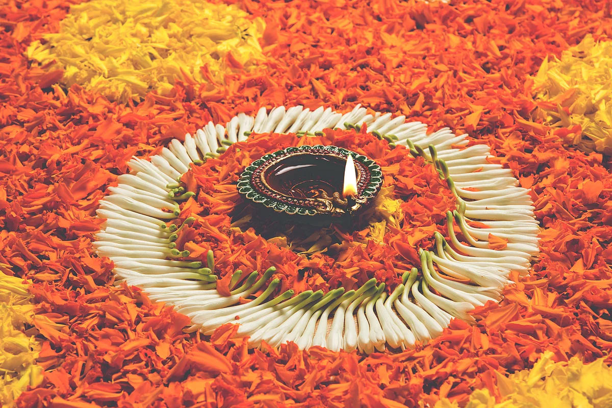 Make rangoli using flower petals.