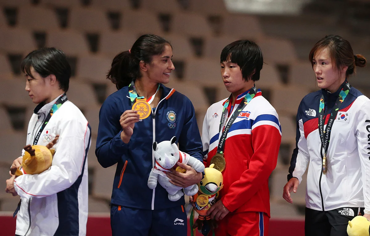 Vinesh Phogat on the podium with her gold medal at the 2018 Asian Games.