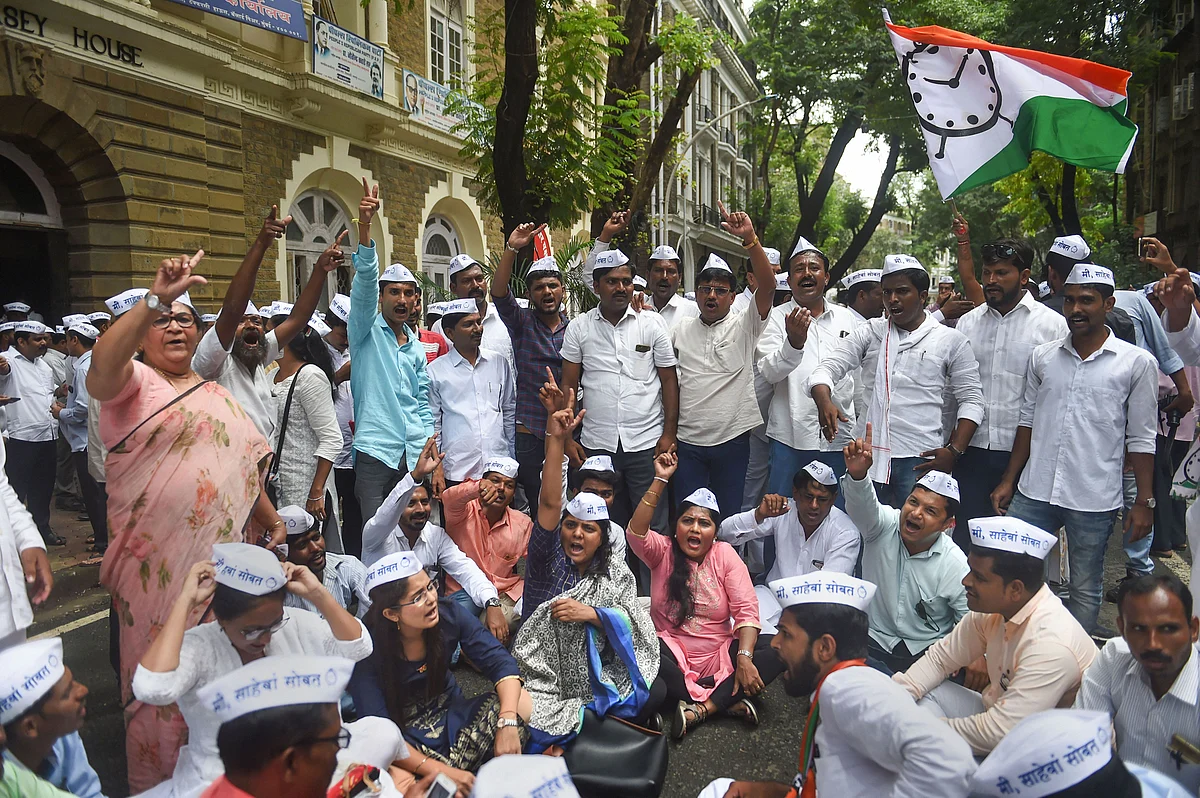 NCP party workers raise slogans during a protest outside ED office to condemn the registration of a money laundering case against party chief Sharad Pawar in connection with the Maharashtra State Cooperative Bank (MSCB) scam, in Mumbai.