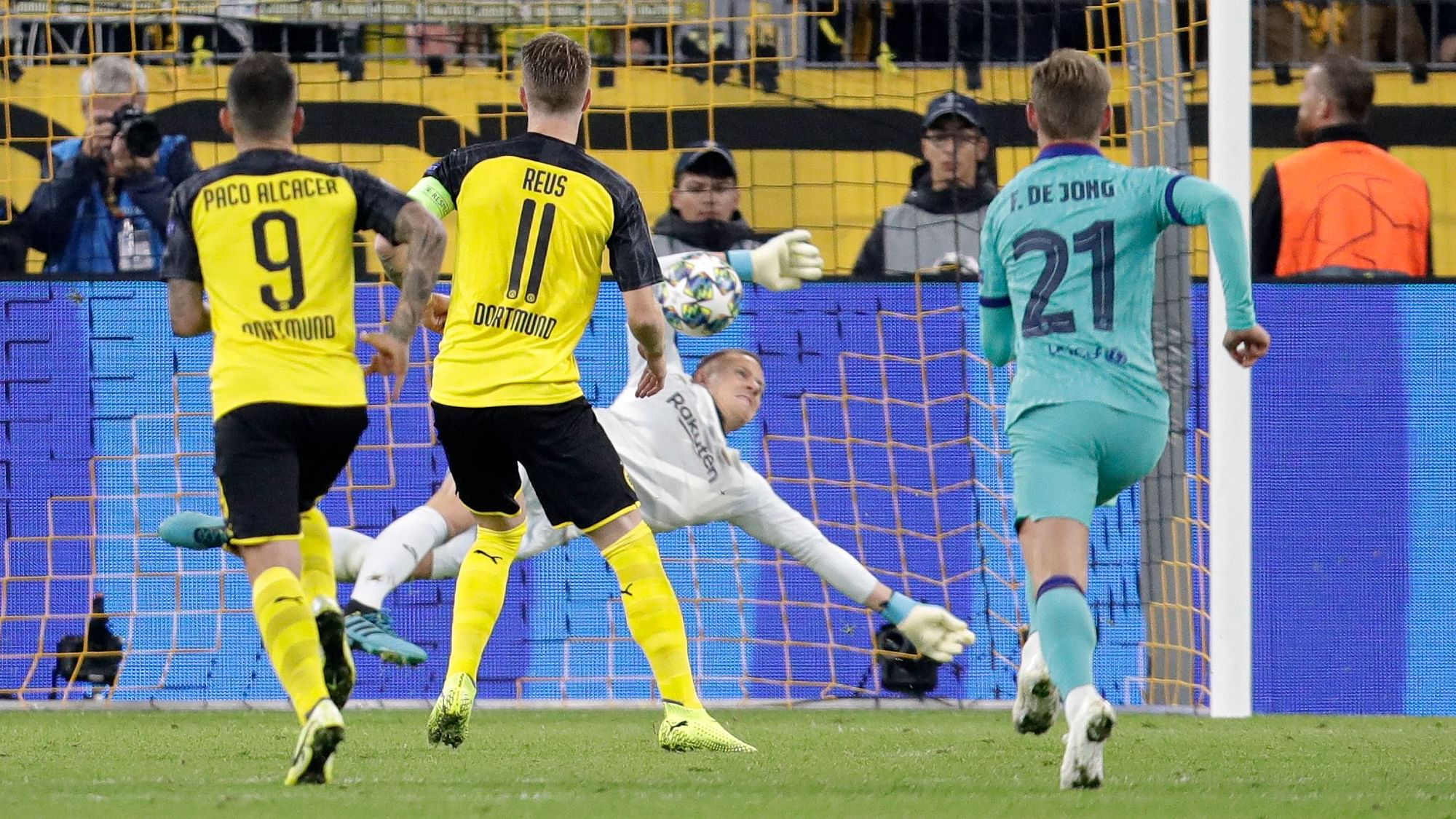 Barcelona goalkeeper Marc-Andre ter Stegen avoided a defeat by saving a penalty from Dortmund captain Marco Reus in the 57th minute.