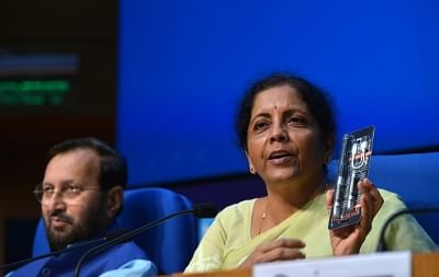 New Delhi: Union Finance and Corporate Affairs Minister Nirmala Sitharaman accompanied by Union Environment, Forest and Climate Change and Information and Broadcasting Minister Prakash Javadekar, addresses during a Cabinet Briefing, in New Delhi on Sep 18, 2019. (Photo: IANS)