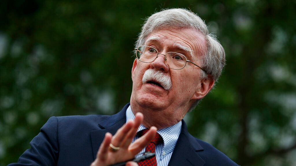 In this 1 May 2019 file photo, John Bolton talks to reporters outside the White House in Washington.&nbsp;