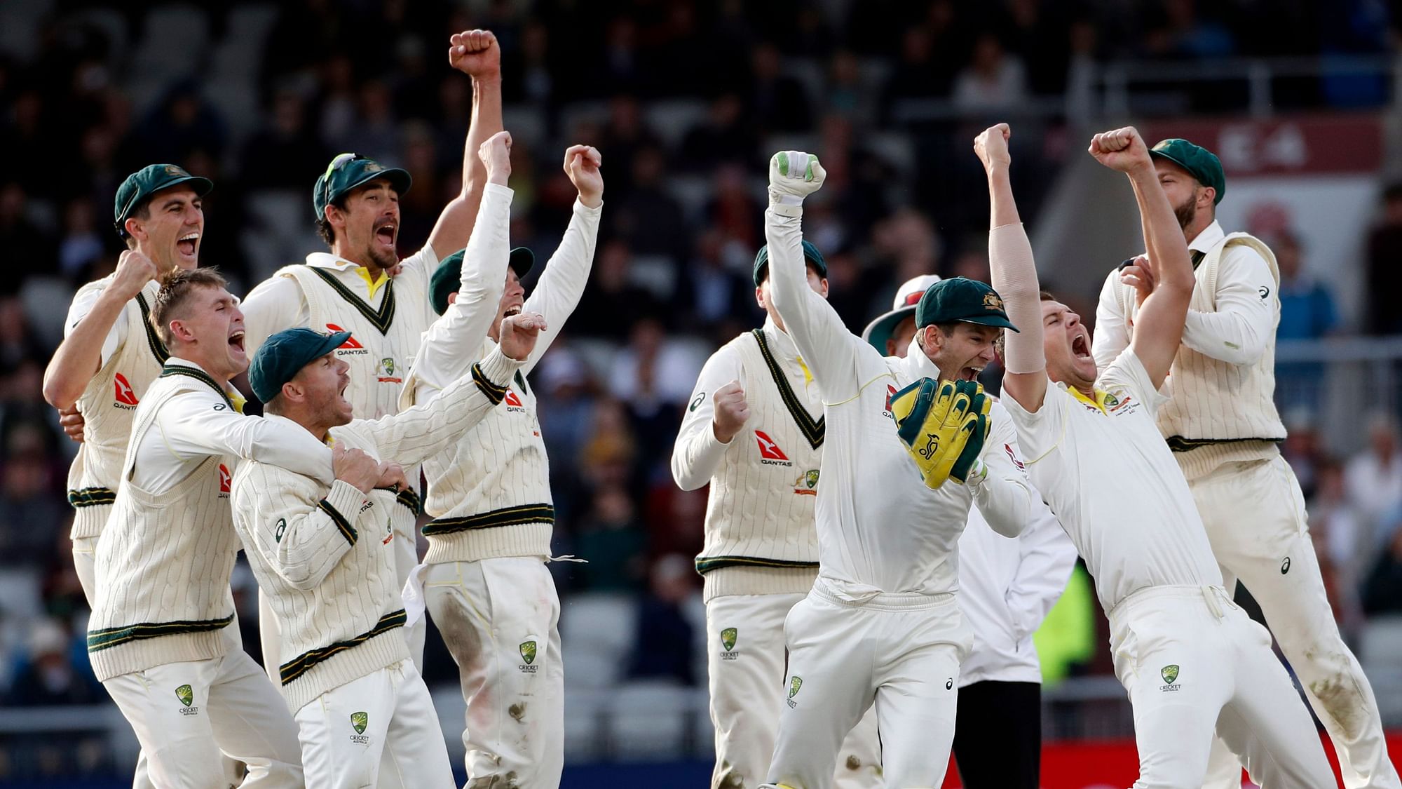 Australia players celebrate after winning the fourth test and retaining the Ashes during day five of the fourth Ashes Test cricket match between England and Australia at Old Trafford in Manchester, England, Sunday Sept 8, 2019.&nbsp;