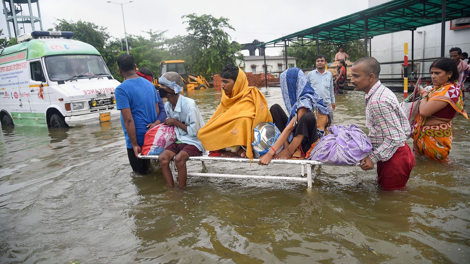 Patients being shifted from flooded Nalanda Medical College and Hospital (NMCH), after heavy monsoon rains in Patna on Saturday, 28 September.