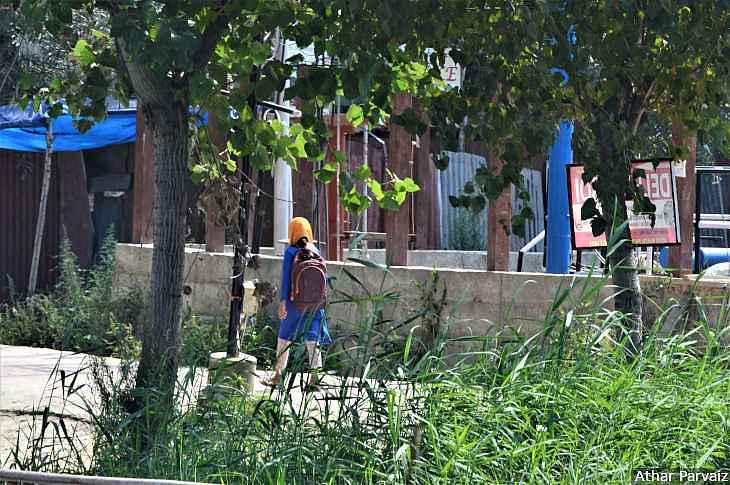 A student going to her tuition classes in Srinagar, September 9. The government said schools reopened on August 19, 2019, but parents have not sent their children to school since August 5 due to security concerns.