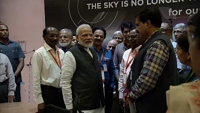 Bengaluru: Prime Minister Narendra Modi motivates scientists at ISRO Centre after communication was lost from Vikram Lander that was scheduled to land on the moon; in Bengaluru on Sep 7, 2019. (Photo: IANS/ISRO)