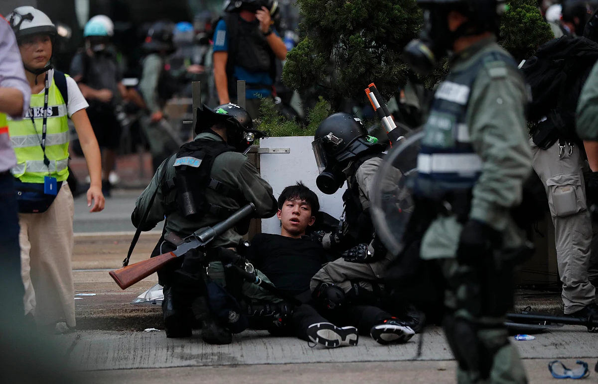 Police use tear smoke on protestors in Hong Kong.Riot police fired tear gas Sunday after a large crowd of protesters at a Hong Kong shopping district ignored warnings to disperse in a second straight day of clashes, sparking fears of more violence ahead of China’s National Day.