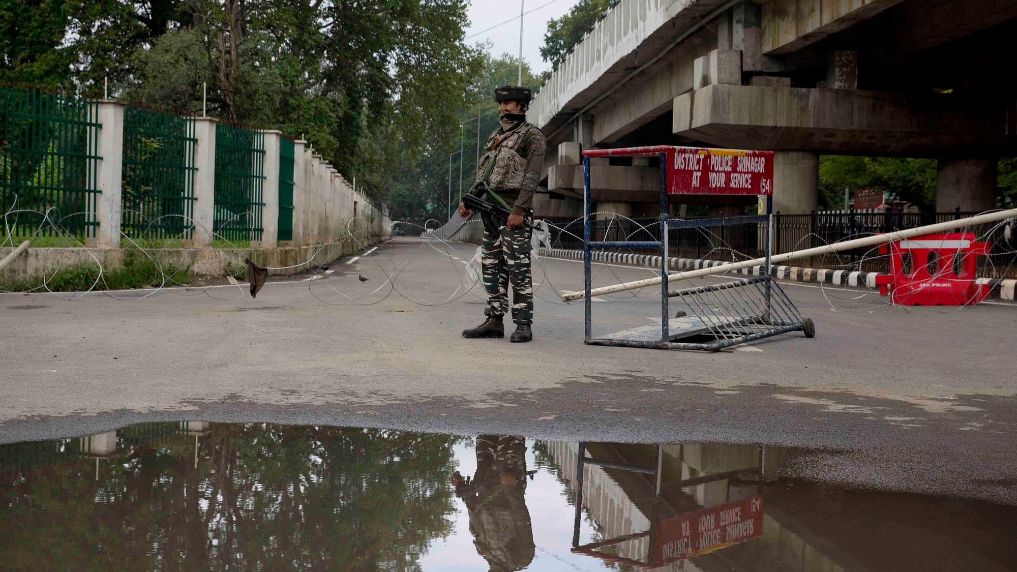 An Indian paramilitary soldier stands guard near a temporary checkpoint on the road leading towards the Independence Day parade venue during lockdown in Srinagar. Image used for representational purposes.