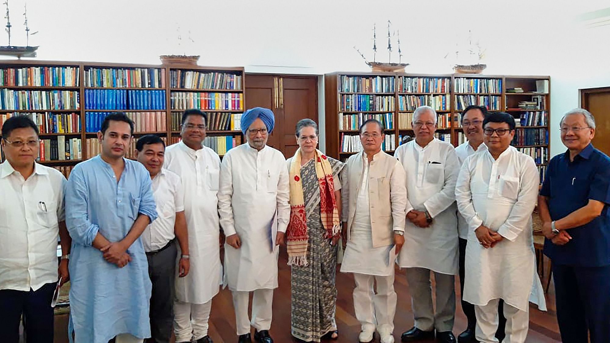  Congress interim President Sonia Gandhi, senior party leader Manmohan Singh and other leaders from North-Eastern states, pose for a photograph in New Delhi on Friday, 13 September.