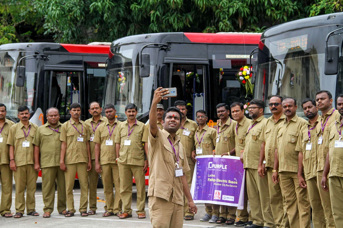 Drivers of Mumbai’s first AC electric buses pose for a photograph after its launch, in Mumbai on Monday, 9 September. A total of six AC electric and four non-AC electric buses launched along with a new mobile app for bus tracking and other features.