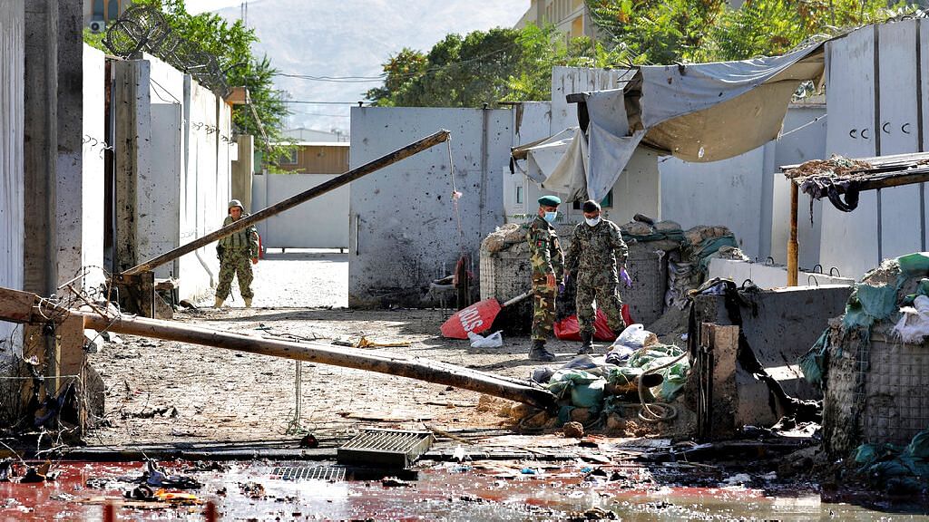  Afghan security forces work at the site of a suicide attack near the US Embassy in Kabul in Afghanistan on 17 September.&nbsp;