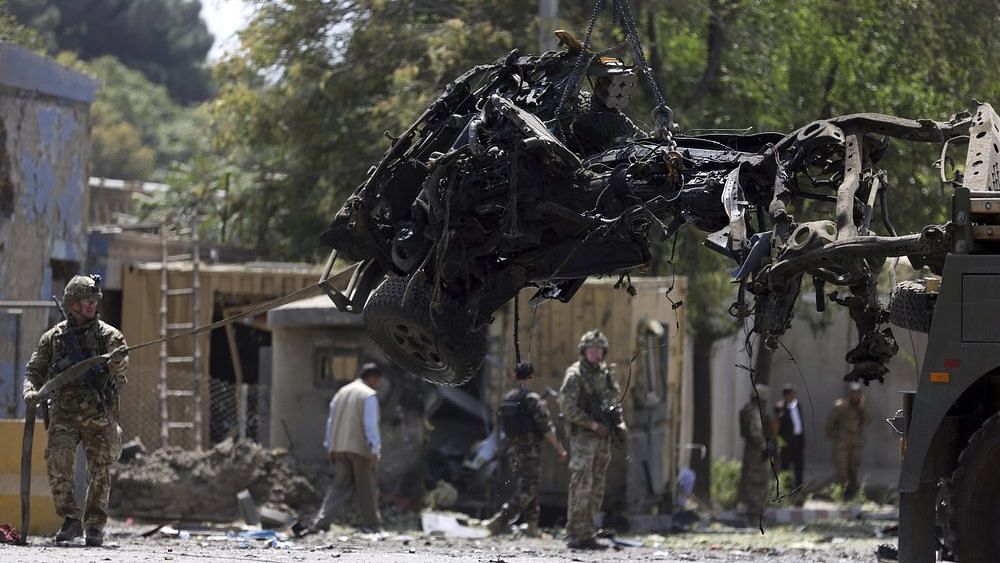 Resolute Support(RS) forces removing damaged vehicle after explosion.
