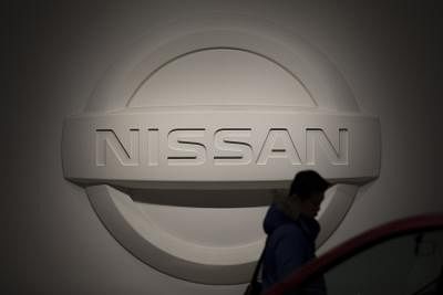 TOKYO, Jan. 8, 2019 (Xinhua) -- A man passes by the Nissan sign in Nissan global headquarters in Yokohama, Japan, Jan. 7, 2019. Nissan Motor Co.