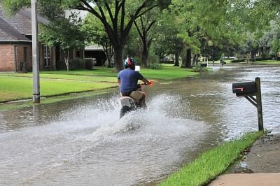 HOUSTON, Aug. 30, 2017 (Xinhua) -- A motorist drives on a waterlogged street in southwest Houston, the United States, on Aug. 29, 2017. Tropical storm Harvey has broken the record of rainfall from a cyclonic storm in the U.S. mainland, with 132 centimeters of rain observed in the state of Texas, authorities said on Tuesday. (Xinhua/Liu Liwei/IANS)