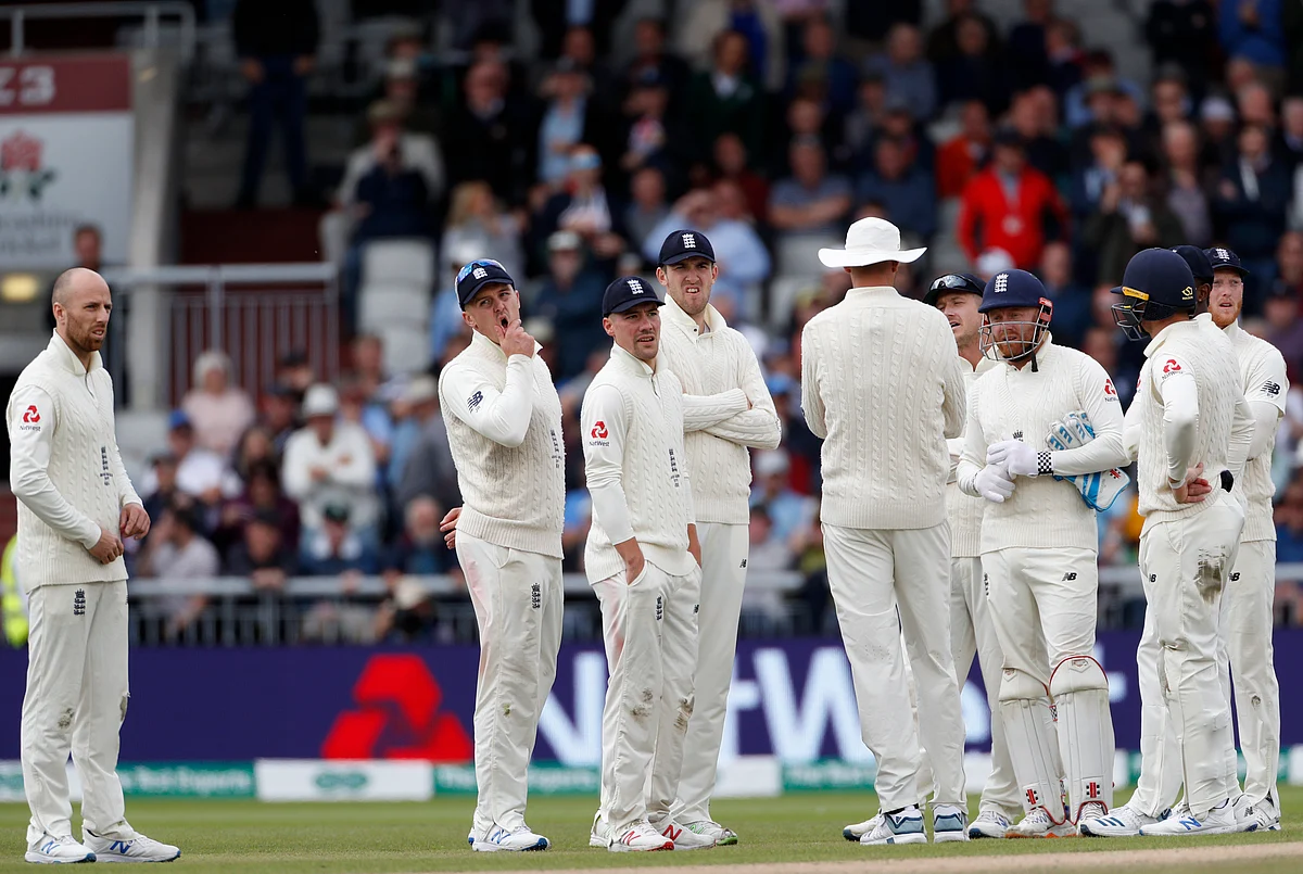 England’s players watch a replay after a no ball decision overturned the dismissal of Australia’s Steve Smith during day two of the fourth Ashes Test cricket match between England and Australia at Old Trafford in Manchester, England, Thursday, Sept. 5, 2019. 