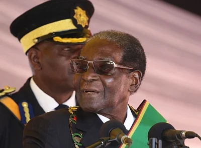 HARARE, Aug. 14, 2017 (Xinhua) -- Zimbabwean President Robert Mugabe (Front) delivers a speech during the Heroes Day commemoration at National Heroes Acre in Harare, Zimbabwe, on Aug. 14, 2017. In an address to mark this year