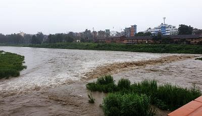 KATHMANDU, July 12, 2019 (Xinhua) -- Photo taken on July 12, 2019 shows the swollen Bagmati river after heavy rainfall in Kathmandu, Nepal. Heavy rains leave Nepalese people at risks of floods and landslides during Monsoon season. Meteorological Forecasting Division under Department of Hydrology and Meteorology (DHM) has issued an alert warning for the next 24 hours across the country after heavy rainfall started from Thursday evening. (Xinhua/Sunil Sharma/IANS)