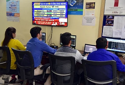 Bikaner: Stock brokers keep a close eye on share prices, in Bikaner on July 8, 2019. Disappointment over the Budget proposals and muted global markets led the Sensex to log the heaviest fall in seven months on Monday. Both the key equity indices -- Sensex and Nifty -- fell over 2 per cent. The 30-scrip Sensex closed 792.82 points or 2.01 per cent lower at 38,720.57 and the broader Nifty50 declined by 252.55 points or 2.14 per cent to 11,558.60. (Photo: IANS)