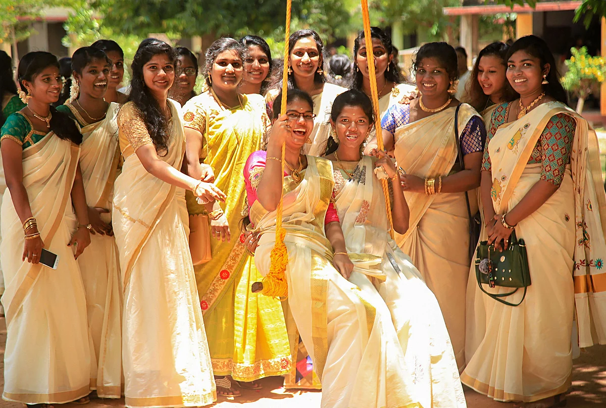 Students pose near a swing during Onam celebrations, in Nagercoil of Kanyakumari district, Tuesday, 10 September. As Kerala gets into the festive mood, police are maintaining tight vigil with the army receiving information that there may be a terror attack in southern parts of the country.