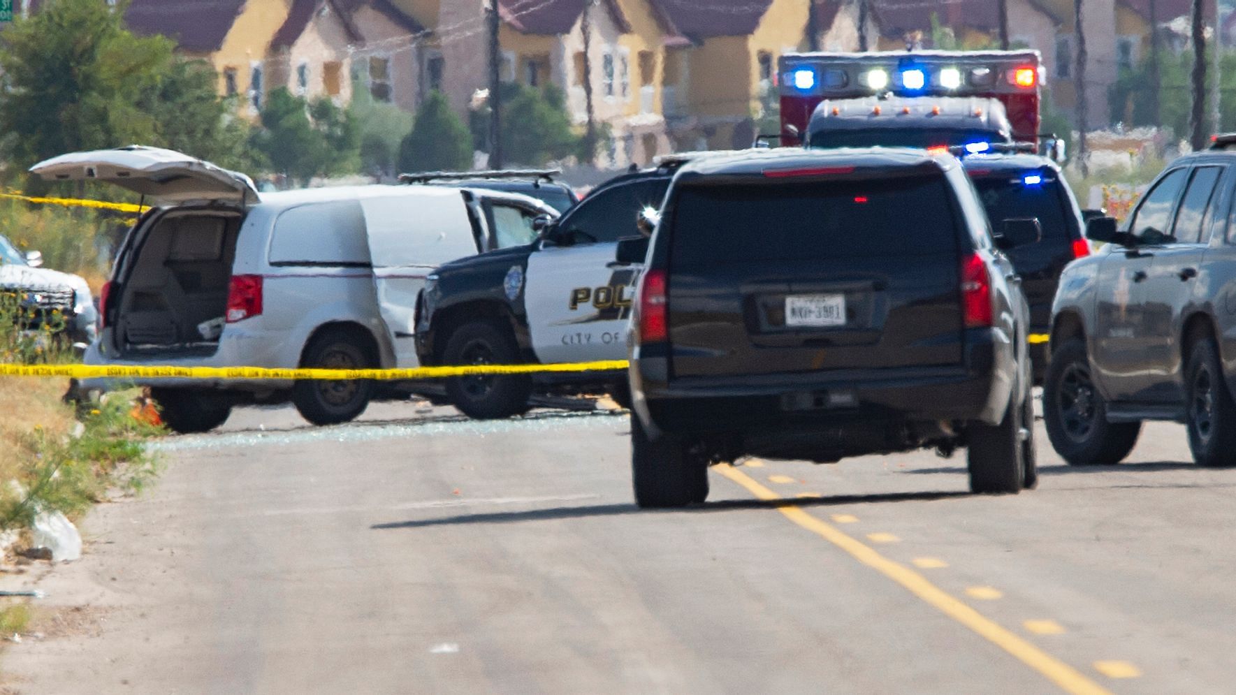 Odessa and Midland police and sheriff’s deputies surround a white van in Odessa, Texas, Saturday, 31 August after reports of gunfire.