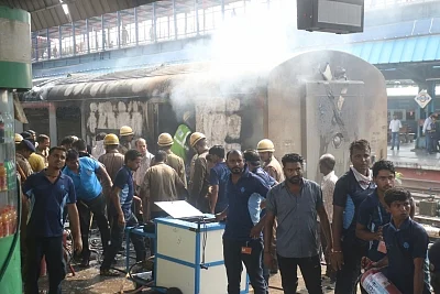 New Delhi: Firefighting operations underway at the New Delhi railway station where a fire broke out in the rear power car of the Chandigarh-Kochuvalli Express, on Sep 6, 2019. No one was injured in the incident that took place at 1.40 p.m. at platform No. 8. (Photo: IANS)
