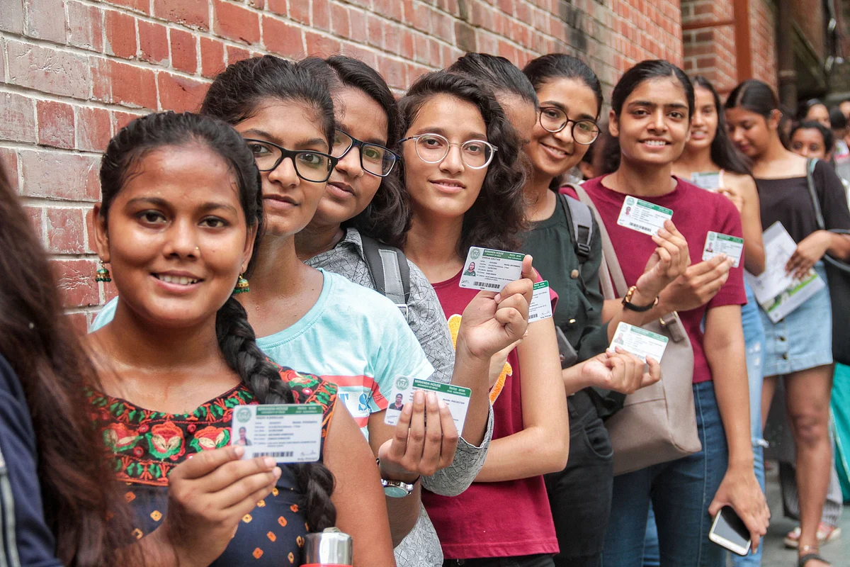 Students queue up with their identity cards to cast their votes for the Delhi University Students Union (DUSU) elections, at Miranda House College in North Campus, New Delhi.