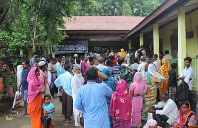 Kamrup: People wait outside the National Register of Citizens (NRC) centre to get their names checked, who were left out in the draft National Register of Citizens (NRC) during an appeal hearing against the non-inclusion of names at an NRC office in Kamrup, Assam on July 23, 2019. (Photo: IANS)