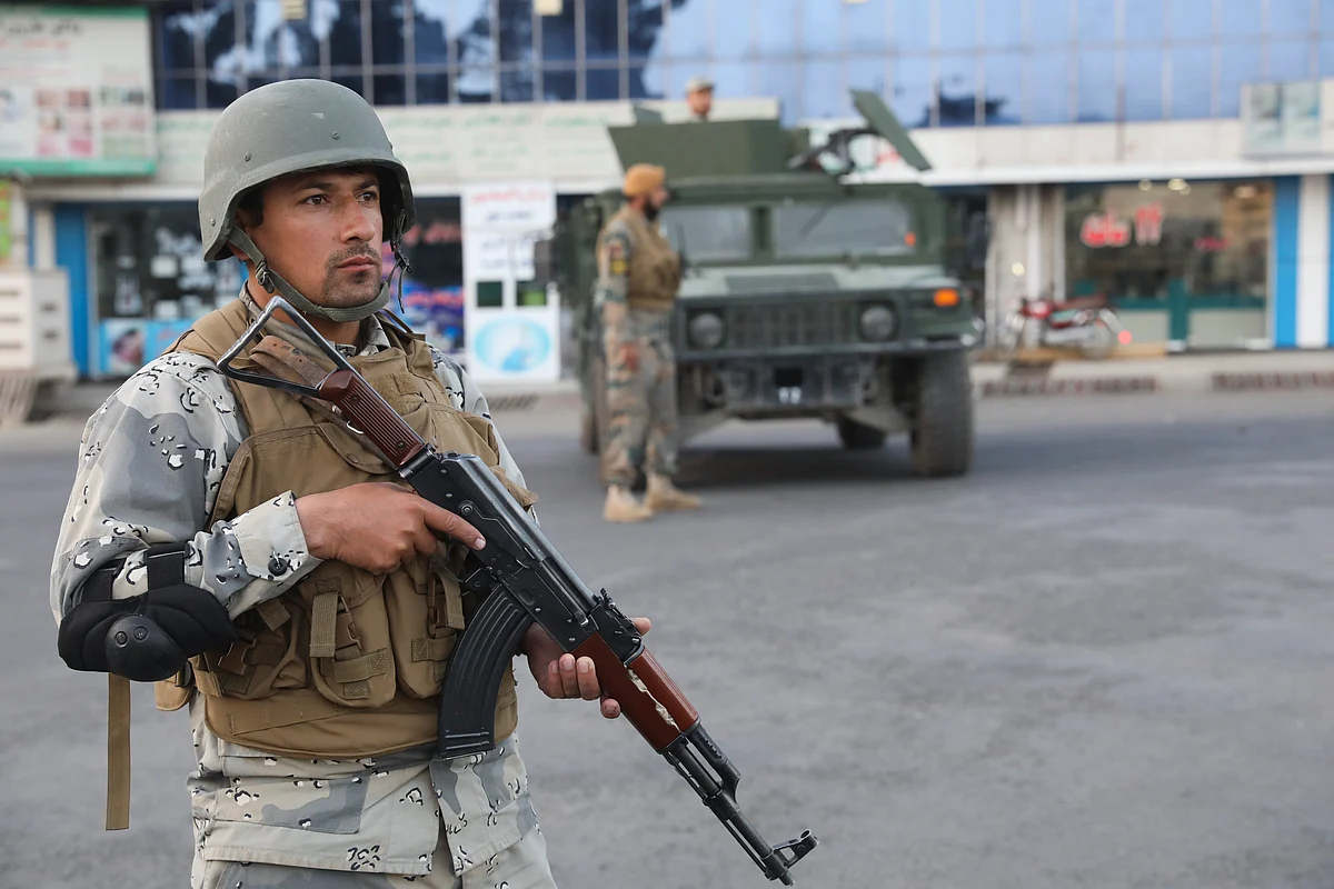 Afghan soldiers stand guard near a polling station in Kabul, Afghanistan.