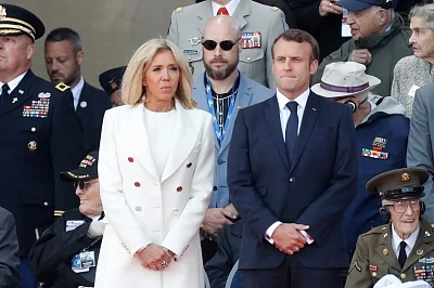NORMANDY, June 7, 2019 (Xinhua) -- French President Emmanuel Macron (R) and his wife Brigitte Macron attend a ceremony to mark the 75th anniversary of the D-Day landing at the Normandy American Cemetery and Memorial in Colleville-sur-Mer, Normandy, France, June 6, 2019. A commemoration was held on Thursday in Normandy, north France, to mark the 75th anniversary of the D-Day landings against Nazi forces in World War II. (Xinhua/Mao When/IANS)