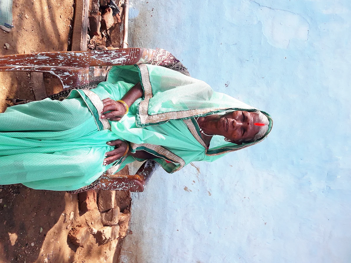 Sadhni, seated in front of her hut in Konka village.