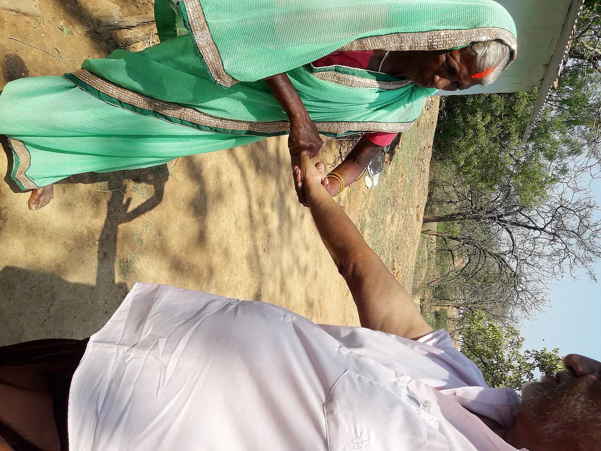Sadhni attends to Dennis Meredith.