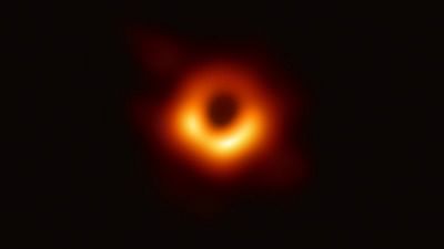 The image – taken by a network of eight telescopes across the world – shows luminous gas swirling around a super-massive black hole 55 million lightyears away at the centre of Messier 87.