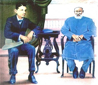 An oil painting of a young MK Gandhi with Dada Abdulla, by Kishorebhat Thanki, now in the Gandhi Smruti Kirti Mandal in Porbandar.